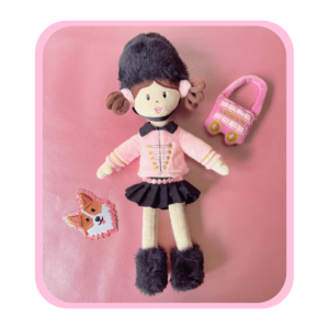 Arabella in London plush doll with a pink London bus handbag and glitter embroidered corgi sticker.